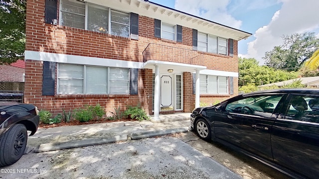 view of property with brick siding