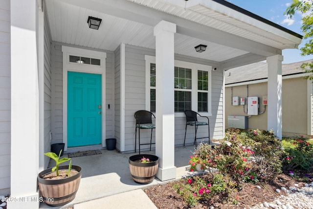view of exterior entry featuring a porch