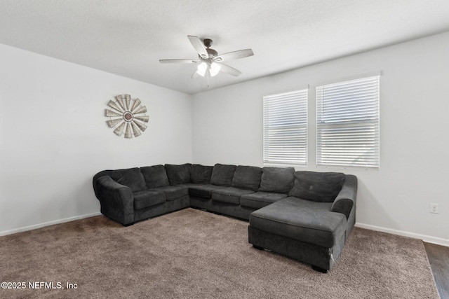 carpeted living room with baseboards and ceiling fan