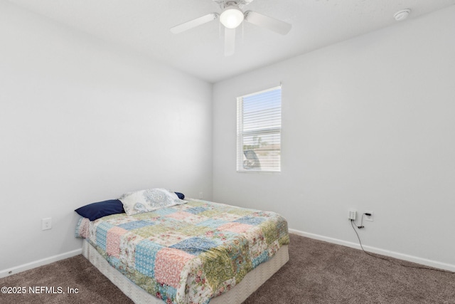 carpeted bedroom with a ceiling fan and baseboards