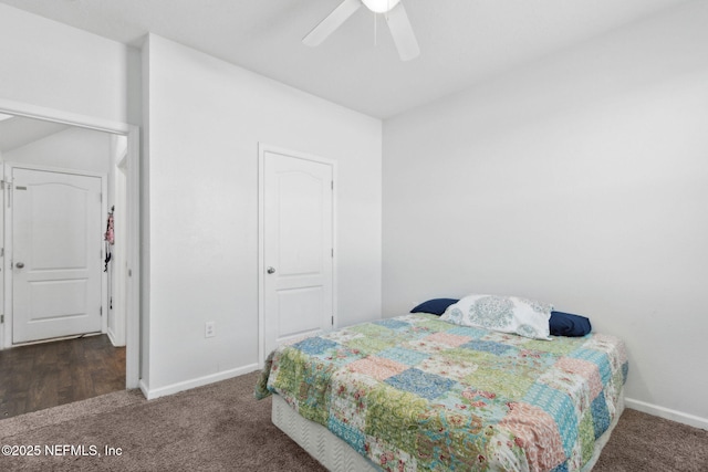 carpeted bedroom featuring baseboards and ceiling fan