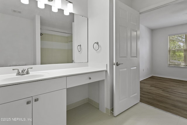 11213 Harbour Vista Cir, Saint Augustine, FL 32080 - bathroom featuring baseboards, visible vents, a shower, and vanity