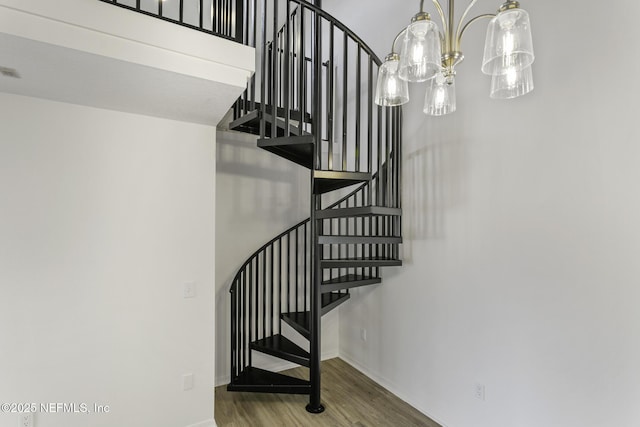 11213 Harbour Vista Cir, Saint Augustine, FL 32080 - staircase with an inviting chandelier, baseboards, and wood finished floors
