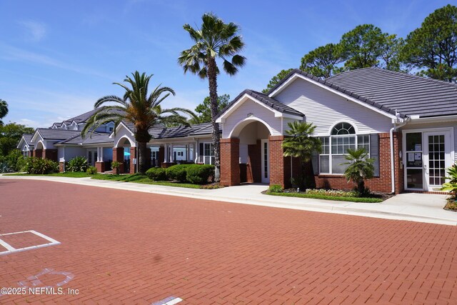 11213 Harbour Vista Cir, Saint Augustine, FL 32080 - ranch-style house with brick siding and a tiled roof