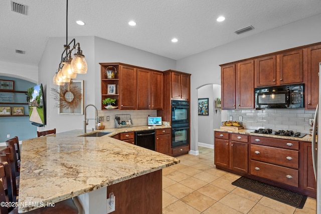 1712 Margarets Walk Rd, Fleming Island, FL 32003 - kitchen featuring visible vents, open shelves, arched walkways, a sink, and black appliances
