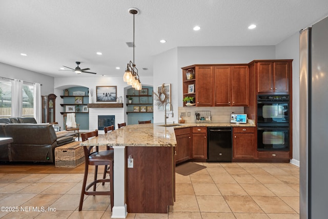 1712 Margarets Walk Rd, Fleming Island, FL 32003 - kitchen with a ceiling fan, black appliances, a peninsula, and open floor plan