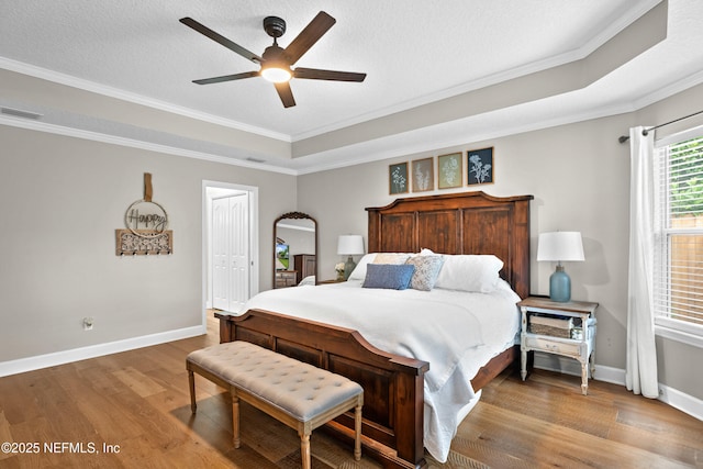 1712 Margarets Walk Rd, Fleming Island, FL 32003 - bedroom with crown molding, baseboards, wood finished floors, and visible vents