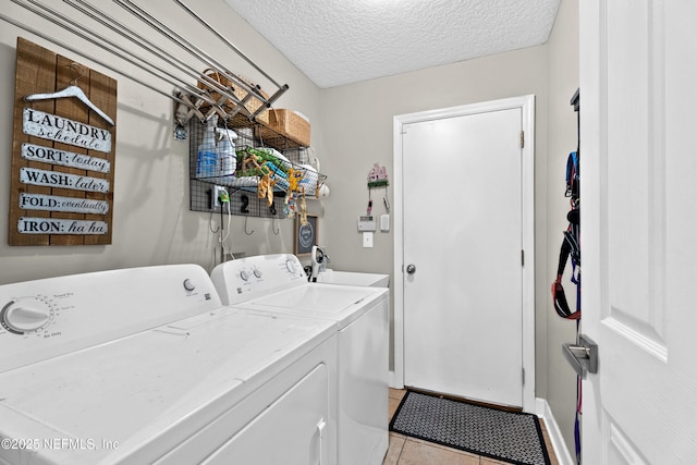 1712 Margarets Walk Rd, Fleming Island, FL 32003 - washroom featuring independent washer and dryer, light tile patterned flooring, laundry area, a sink, and a textured ceiling