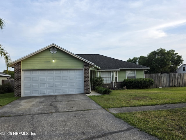 ranch-style house featuring driveway, fence, brick siding, a front lawn, and a garage