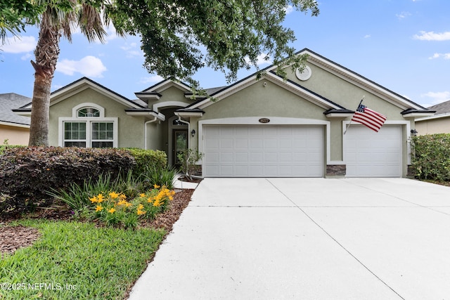 single story home with an attached garage, driveway, and stucco siding
