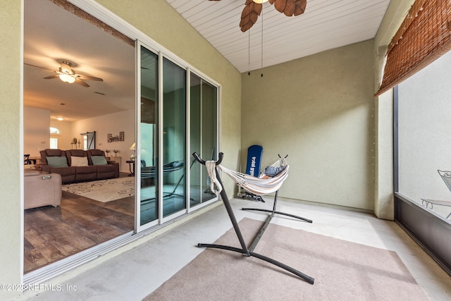 exterior space featuring a ceiling fan, a patio area, and outdoor lounge area