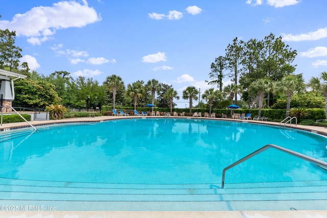 community pool featuring fence