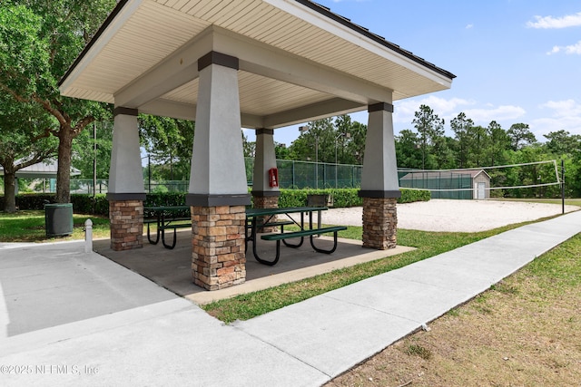 view of home's community featuring a gazebo, fence, and volleyball court