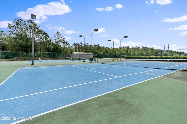 view of sport court featuring community basketball court and fence