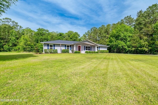 ranch-style house featuring a front lawn