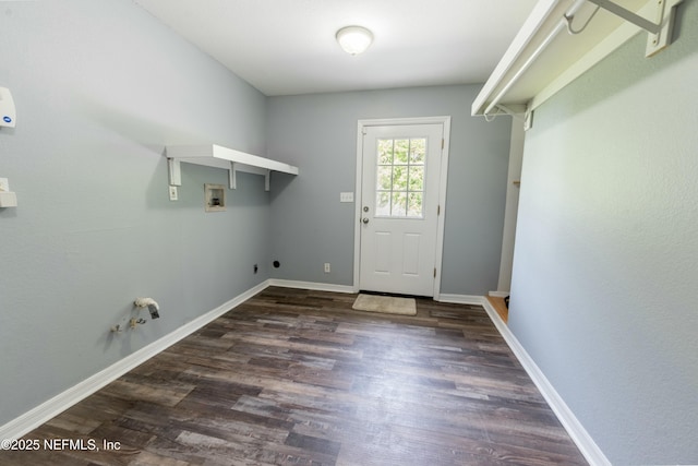 clothes washing area featuring dark wood-style flooring, baseboards, hookup for a washing machine, gas dryer hookup, and laundry area