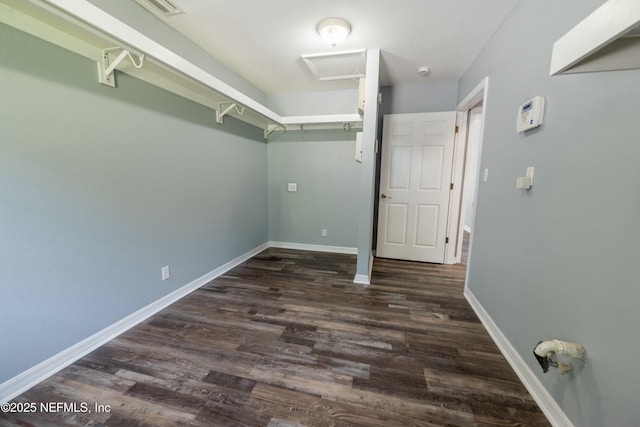 basement featuring baseboards and wood finished floors