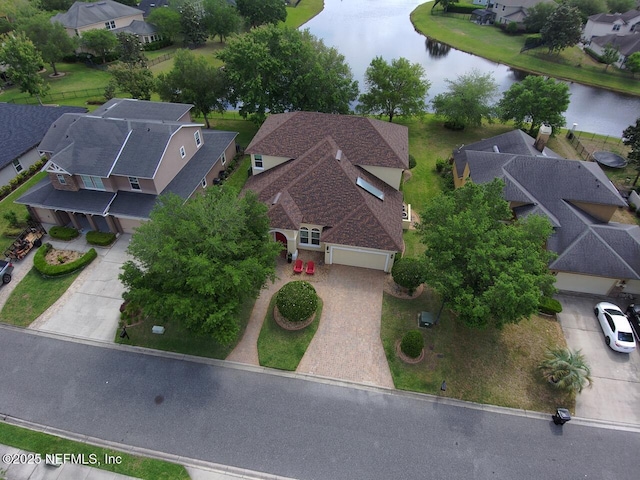 bird's eye view with a residential view and a water view