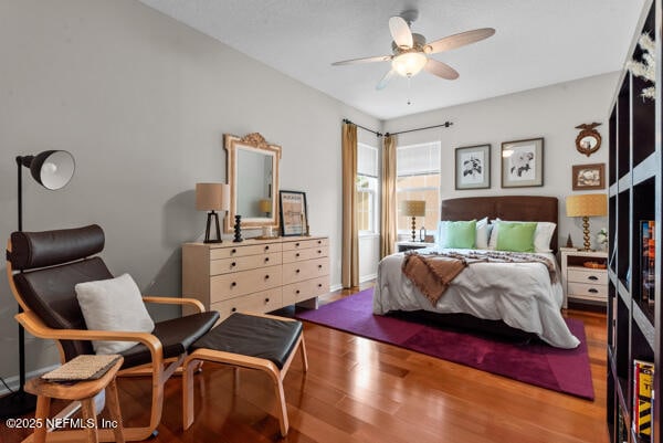bedroom featuring wood finished floors