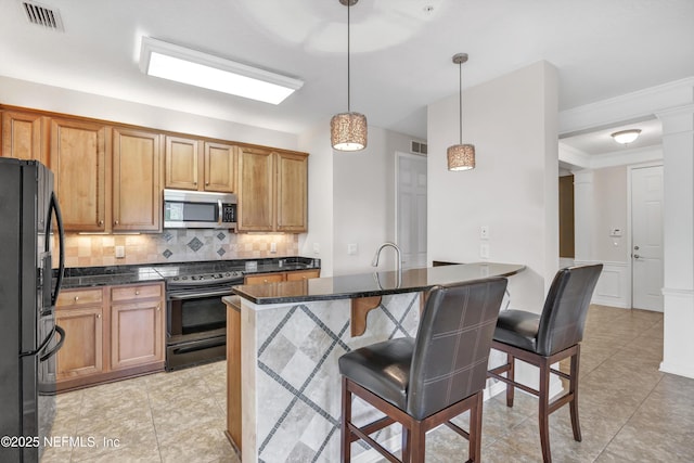 9831 Del Webb Pkwy Unit 1302, Jacksonville, FL 32256 - kitchen with black fridge with ice dispenser, stainless steel microwave, electric range, backsplash, and a kitchen bar