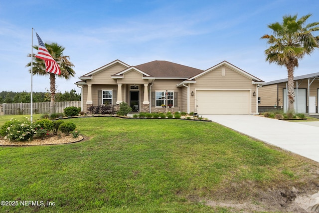 craftsman-style home with fence, an attached garage, driveway, and a front lawn