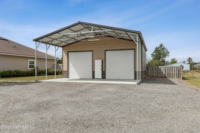 garage with a garage and fence