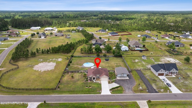 aerial view featuring a view of trees