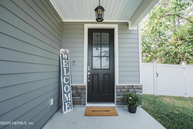 1209 Hammock Dunes Dr, Jacksonville, FL 32221 - doorway to property with fence and stone siding