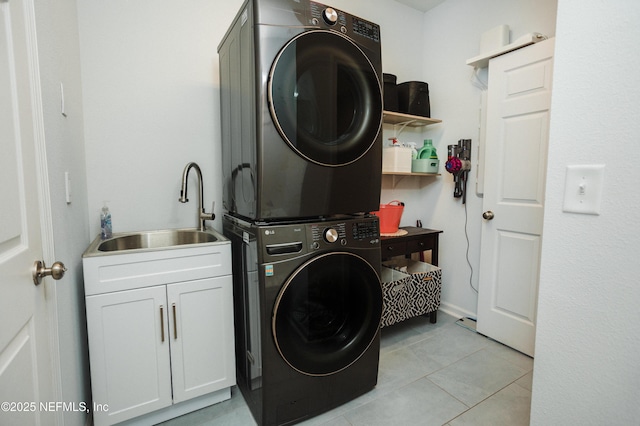 1209 Hammock Dunes Dr, Jacksonville, FL 32221 - laundry room featuring stacked washer and dryer, light tile patterned floors, cabinet space, and a sink