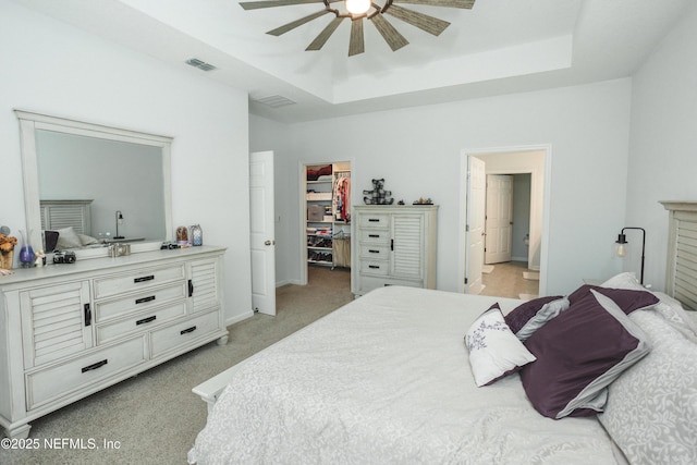 1209 Hammock Dunes Dr, Jacksonville, FL 32221 - bedroom with a raised ceiling, visible vents, light carpet, a spacious closet, and ensuite bath