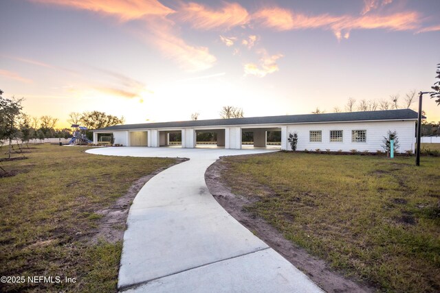 1209 Hammock Dunes Dr, Jacksonville, FL 32221 - view of front of property featuring a front lawn, playground community, and driveway