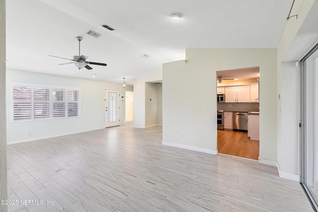 unfurnished living room featuring a ceiling fan, visible vents, lofted ceiling, and light wood-style floors