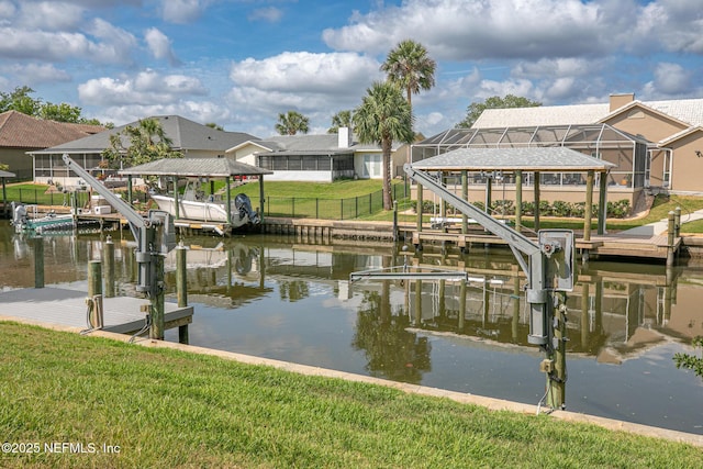 view of dock with a yard, a water view, a residential view, and boat lift