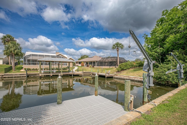 view of dock with boat lift and a water view