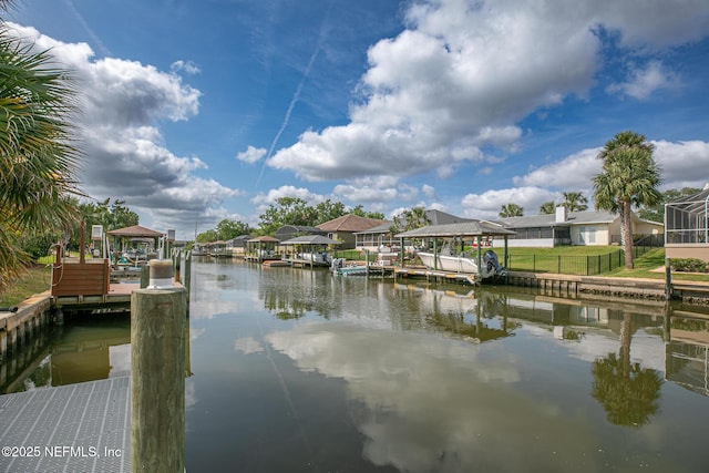 dock area featuring a gazebo, a water view, and a residential view