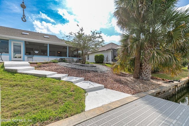 view of yard featuring a sunroom