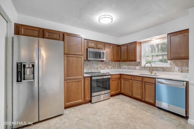 11453 Cypress Bend Ct, Jacksonville, FL 32223 - kitchen featuring a sink, appliances with stainless steel finishes, backsplash, and light countertops