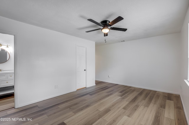 11453 Cypress Bend Ct, Jacksonville, FL 32223 - unfurnished bedroom with a ceiling fan, visible vents, baseboards, light wood finished floors, and ensuite bathroom