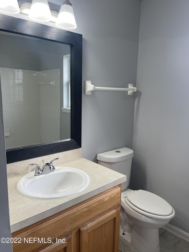 bathroom featuring toilet and vanity