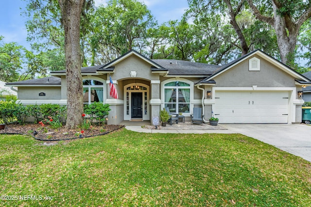 ranch-style house featuring an attached garage, concrete driveway, a front lawn, and stucco siding