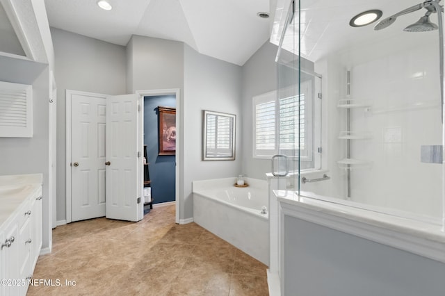 full bath with a shower stall, tile patterned flooring, vanity, a bath, and baseboards