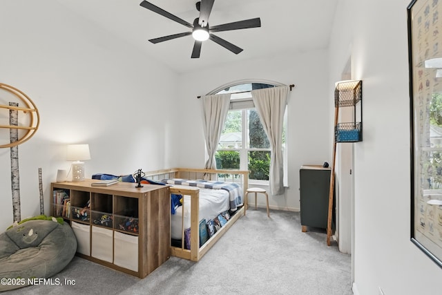 carpeted bedroom featuring a ceiling fan and baseboards