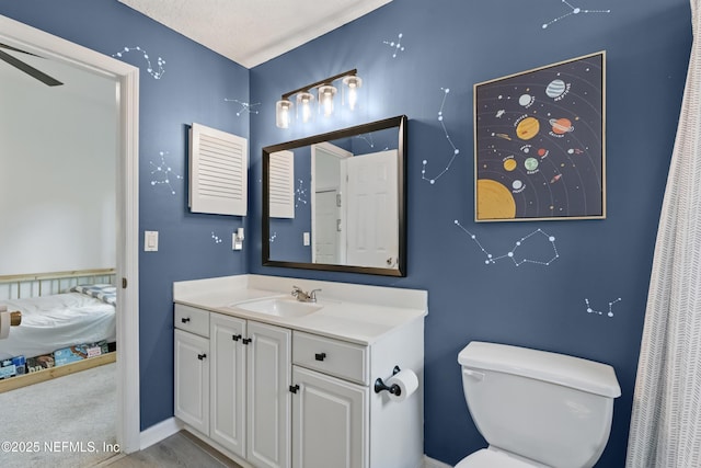 bathroom with toilet and vanity