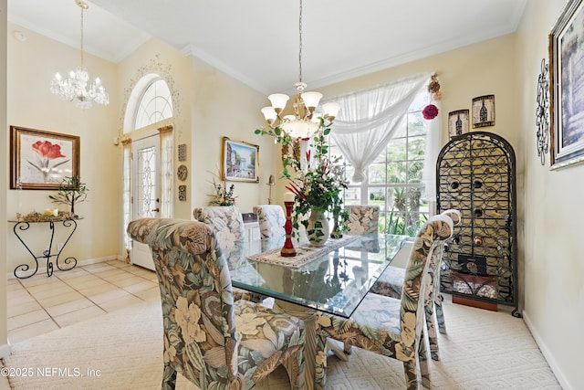 104 Twin Cedar Ct, Ponte Vedra Beach, FL 32082 - dining area with baseboards, a chandelier, light tile patterned floors, and crown molding