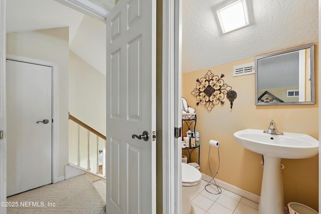104 Twin Cedar Ct, Ponte Vedra Beach, FL 32082 - bathroom featuring tile patterned floors, a textured ceiling, toilet, baseboards, and visible vents
