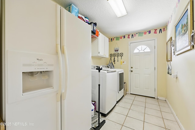 104 Twin Cedar Ct, Ponte Vedra Beach, FL 32082 - washroom with light tile patterned floors, washing machine and dryer, baseboards, cabinet space, and a textured ceiling