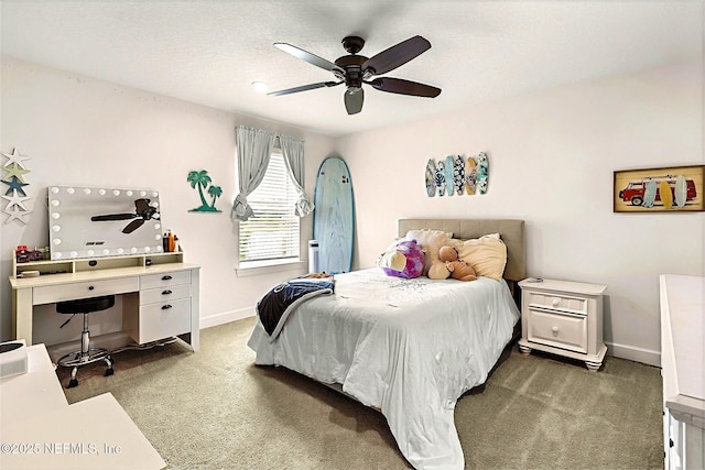 carpeted bedroom with baseboards and a ceiling fan