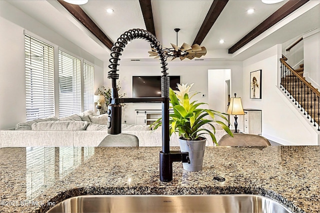 interior details featuring tile countertops, beamed ceiling, and recessed lighting