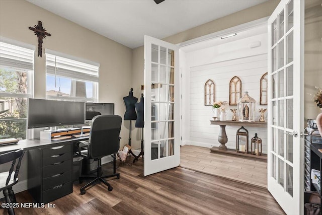 office featuring baseboards, french doors, and wood finished floors