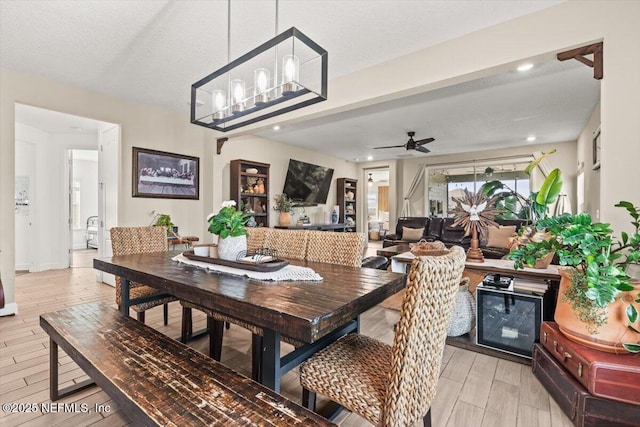 dining room featuring light wood-type flooring, baseboards, recessed lighting, and ceiling fan